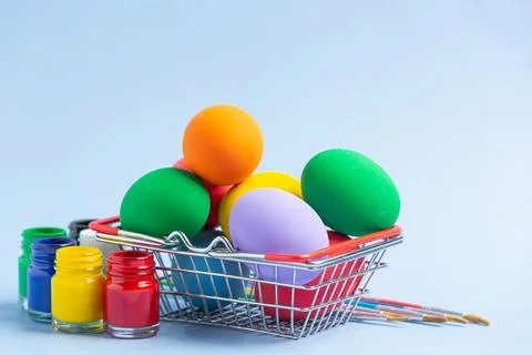 Colorful Easter egg and bunny rabbit ears on table Стоковые фото