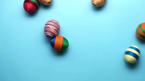 Colorful easter egg made from threads isolated on blue background. Stock Footage 171059299