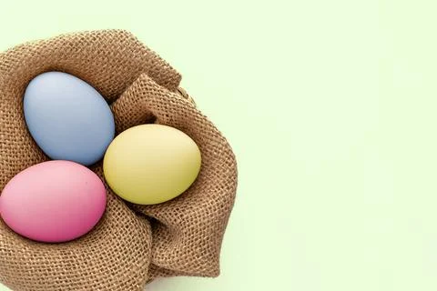 Colorful Easter egg over a burlap background Stock Photos