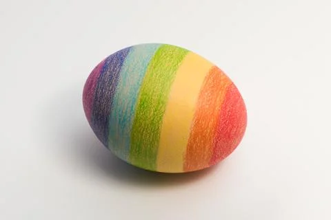 Colorful easter egg painted in rainbow colors of happiness or a flag of LGBTQ Stock Photos