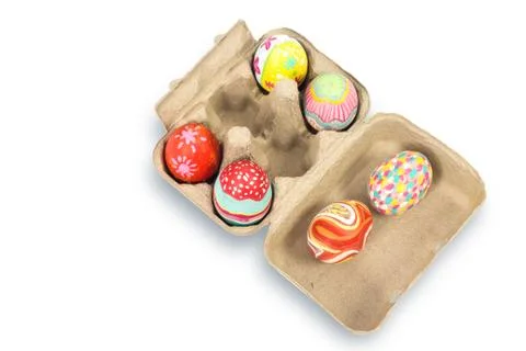 Colorful easter egg in pulp box on white background Stock Photos