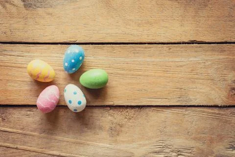 Colorful easter egg on wood background with space. Stock Photos