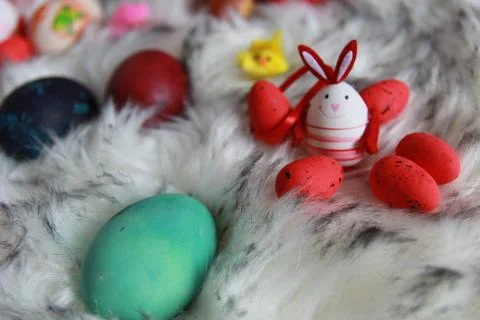 Colorful Easter eggs and decorations on soft fur background create a festiv.. Stock Photos