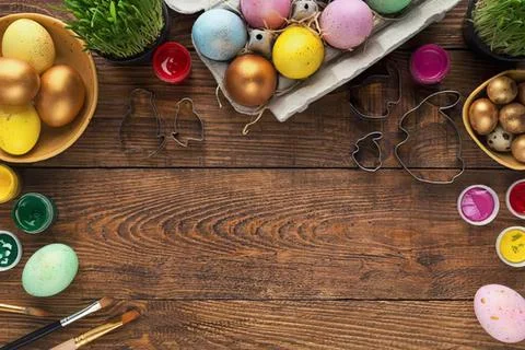 Colorful easter eggs and decorations on wooden table Stock Photos