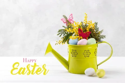 Colorful Easter eggs and mimosa flowers 写真素材