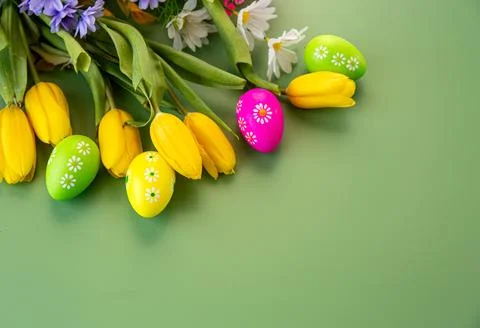 Colorful easter eggs and spring flowers decorative background Stock Photos