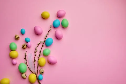 Colorful easter eggs and willow on pink background Stock Photos