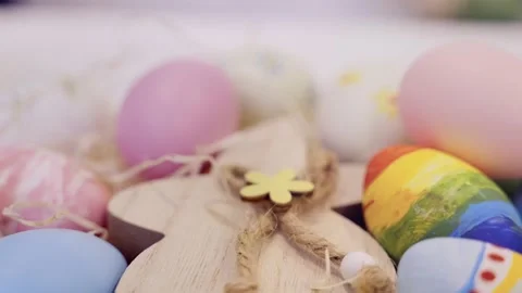 Colorful Easter eggs and wooden bunny on Easter background. Easter decorations. Stock Footage 236341759