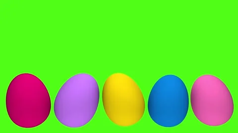Colorful Easter eggs appear on a green chroma key background Video stock 329555088