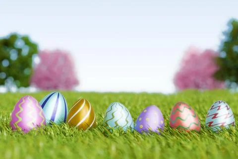 Colorful Easter eggs arranged on green grass under a clear sky Illustrazione stock