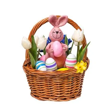 Colorful Easter eggs in basket and knitted bunny Stock Photos
