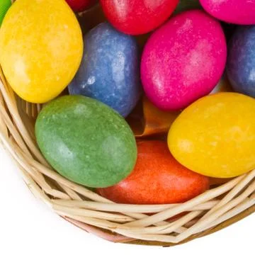 Colorful easter eggs in basket Stock Photos