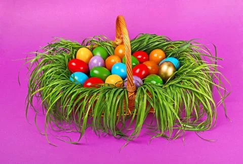Colorful easter eggs in basket Stock Photos