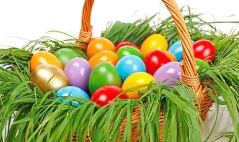 Colorful easter eggs in basket Stock Photos