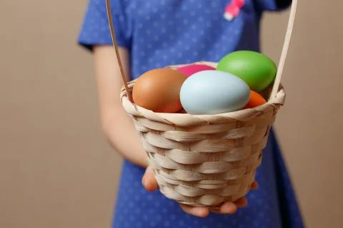Colorful Easter eggs in a basket Stock Photos