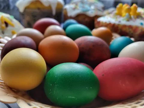 Colorful Easter eggs in a basket Stock Photos