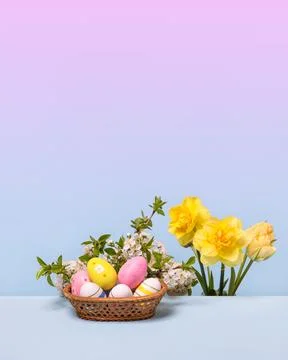 Colorful Easter eggs in basket Stock Photos