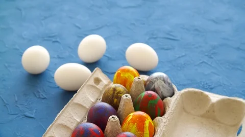 Colorful Easter eggs on blue background. Easter holiday decorations concept Stock Footage 126569359