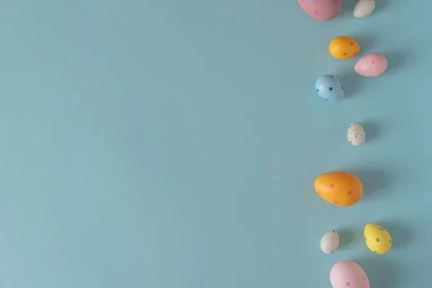 Colorful Easter Eggs on Blue Background. Festive Spring Background Stock Photos