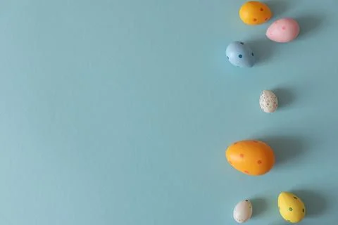 Colorful Easter Eggs on Blue Background. Festive Spring Background Stock Photos