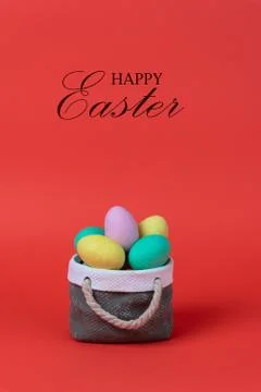 Colorful easter eggs with ceramic basket concept. Stock Photos