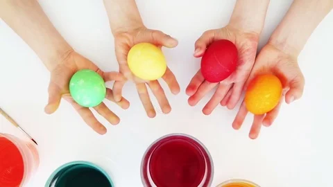 Colorful easter eggs in child hands. Top view Stock Footage 72152096