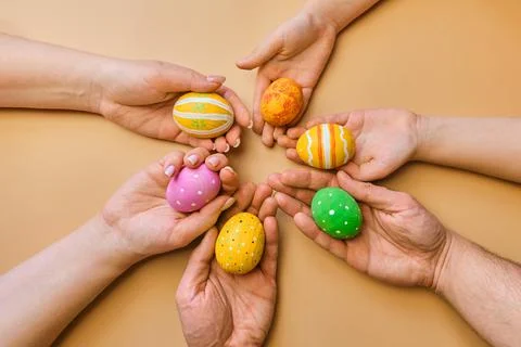 Colorful easter eggs in child hands after egg-hunt Stock Photos