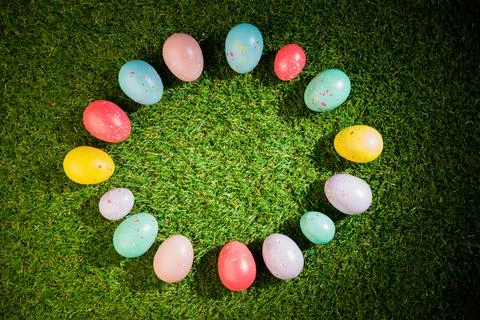 Colorful Easter eggs in circle on grass Stock Photos