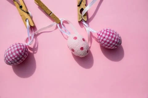 Colorful Easter Eggs with Cross hanging on line from clothespins.Still Life Stock Photos