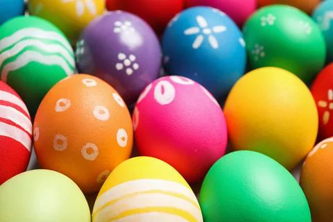 Colorful Easter eggs with different patterns as background, closeup 库存照片
