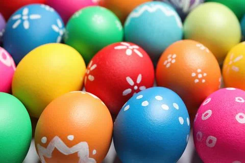 Colorful Easter eggs with different patterns as background, closeup 库存照片