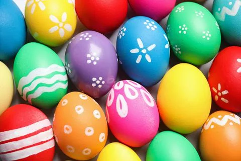 Colorful Easter eggs with different patterns as background, top view 库存照片