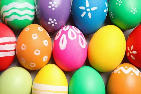 Colorful Easter eggs with different patterns as background, top view 库存照片