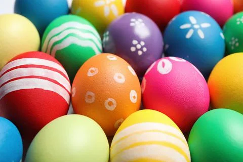 Colorful Easter eggs with different patterns as background, closeup 库存照片