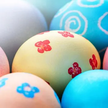 Colorful Easter eggs dyed by colored water with beautiful pattern on a pale b Fotos de archivo
