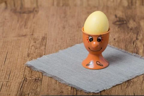 Colorful easter eggs in egg cup Stock Photos