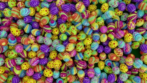 Colorful Easter eggs, fall into the frame and fill it completely. Green backgrou Stock-Footage 84773252