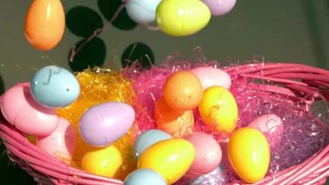 Colorful Easter Eggs Falling into Basket  Slow Motion Shot Stock Footage 301157238