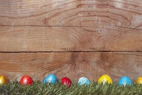 Colorful Easter eggs on the grass Stock Photos