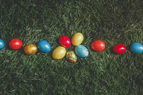 Colorful Easter eggs on the grass Stock Photos