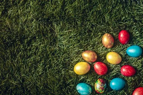 Colorful Easter eggs on the grass Stock Photos