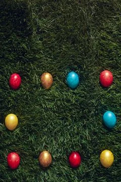 Colorful Easter eggs on the grass Stock Photos