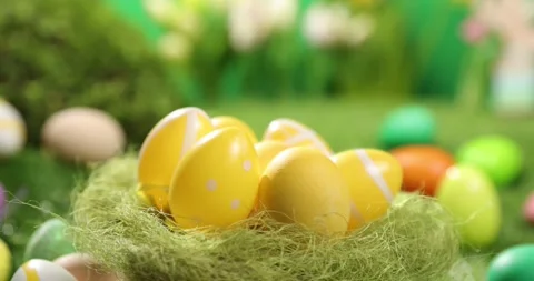 Colorful Easter eggs on the grass. Top view rotating of colorful easter eggs Stock Footage 175373184