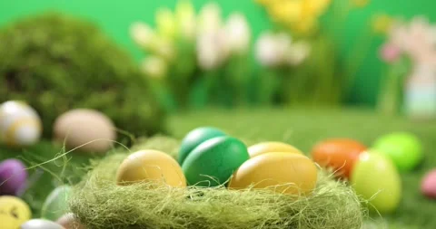 Colorful Easter eggs on the grass. Top view rotating of colorful easter eggs Stock Footage 175381172