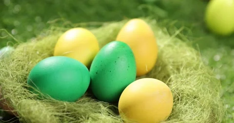 Colorful Easter eggs on the grass. Top view rotating of colorful easter eggs Stock Footage 175386168