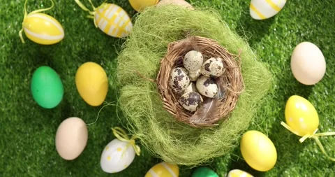 Colorful Easter eggs on the grass. Top view rotating of colorful easter eggs Stock Footage 175405506