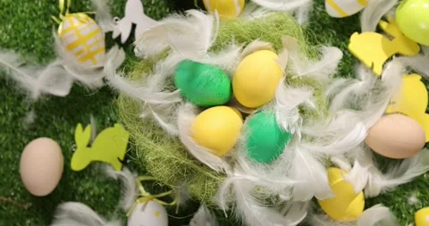 Colorful Easter eggs on the grass. Top view rotating of colorful easter eggs Stock Footage 175409834