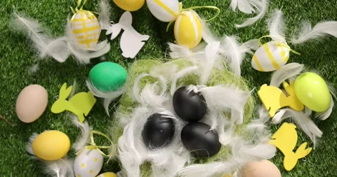 Colorful Easter eggs on the grass. Top view rotating of colorful easter eggs Stock Footage 175419978