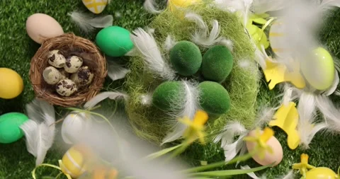 Colorful Easter eggs on the grass. Top view rotating of colorful easter eggs Stock Footage 175428986