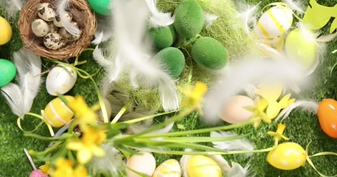 Colorful Easter eggs on the grass. Top view rotating of colorful easter eggs Stock Footage 175434857
